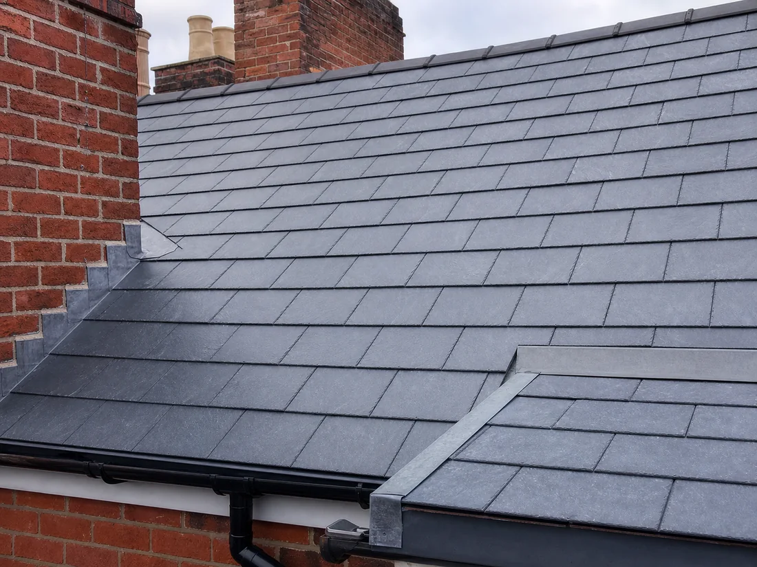 Completed slate repair on a UK residential roof